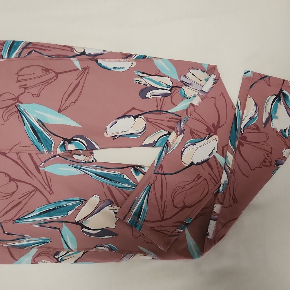 Leggings by Carrie Underwood size M. Pink with blue flowers.
